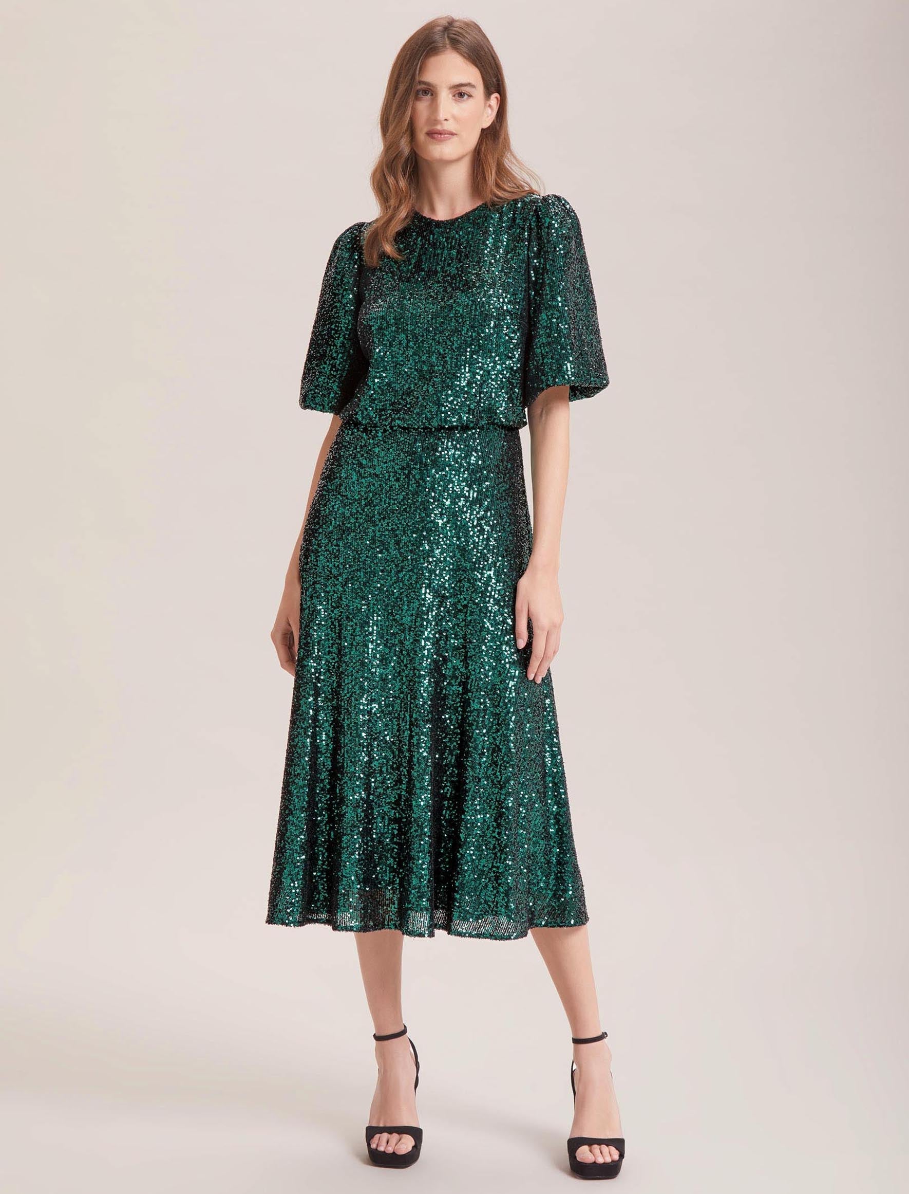 COS - Green to be seen. Discover our sculpted midi dress, finished in a  deep emerald hue.​ Discover dresses